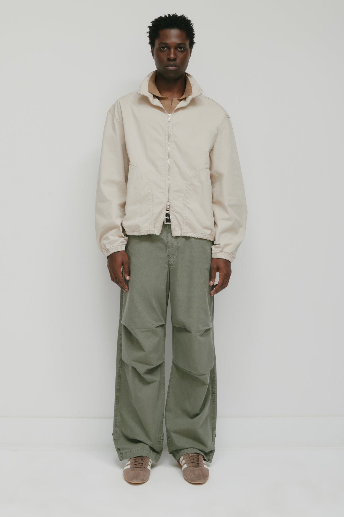 Model 6.2" and is wearing a size L.